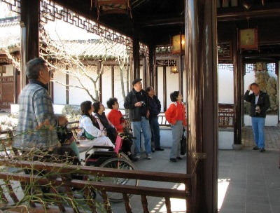 Visitors to the New York Scholar's Garden on Staten Island, listen intently to the information about the garden.