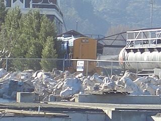 Taihu Rocks, from China, look a little out of place, whilst stock piled behind the garden's construction zone, proper.