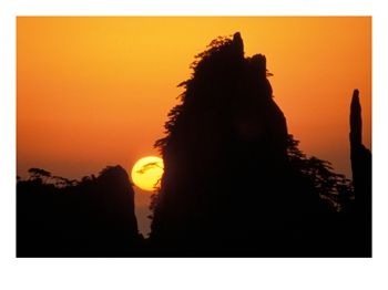 Sun setting behind Mt. Huangshan