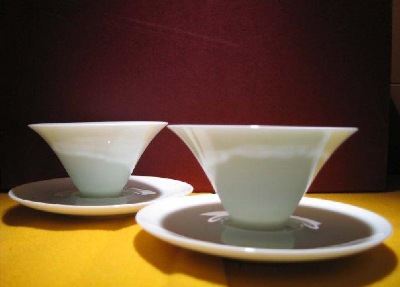 White ceramic tea cups from  " One Tea House - Siang Ming Tea Shop."