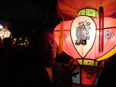 China Lantern Festival - a close-up of how attracted people can be to these beautiful lights and how beautifully they enlighten the persons attracted.