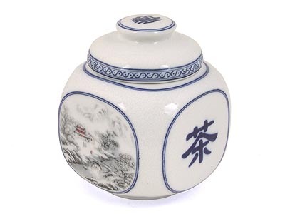 A porcelain Chinese Tea container, with the Chinese character for tea on one side.
