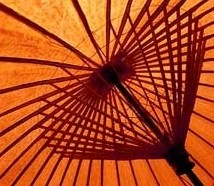 Some prefer the protection of a Chinese umbrella.